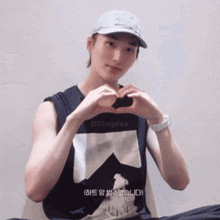 a man wearing a hat and a tank top that says ddimples