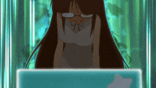 a girl wearing glasses is looking at a screen