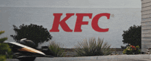 a large kfc sign is painted on a wall