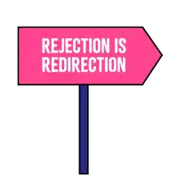 a sign that says ' rejection is redirection ' on it