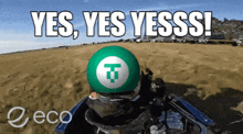 a green ball with a t on it and the words yes yes yesss written above it