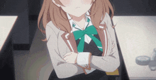 a girl in a school uniform with a green bow on her shirt