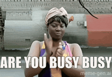 a woman giving the middle finger with the caption " are you busy busy " below her
