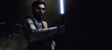 a cartoon character is holding a light saber in a dark room