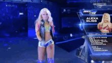 a female wrestler named alexa bliss is standing on a blue stage