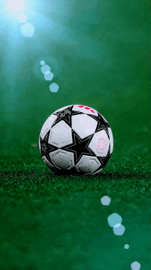a soccer ball with a star on it is on a field