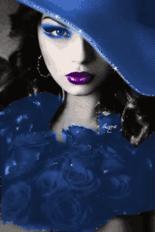 a woman wearing a blue hat and purple lipstick has the word capric written on her chest