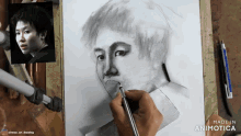 a drawing of a man 's face is being made in animatica