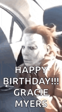 a person wearing a halloween mask is sitting in a car with the words `` happy birthday !!! gracie myers '' .