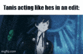 a gif of a man in a suit with the caption " tanis acting like hes in an edit "