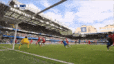 a soccer game is being played at the chelsea football club stadium
