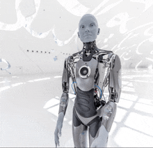 a robot is standing in a white room and has a camera on its chest