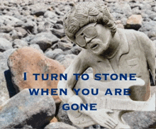 a statue of a man playing a guitar with the words i turn to stone when you are gone