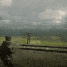 a blurry picture of a person standing on a grassy field