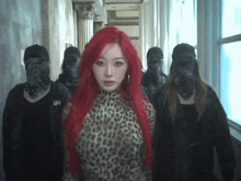 a woman with red hair and a leopard print top is surrounded by masked men
