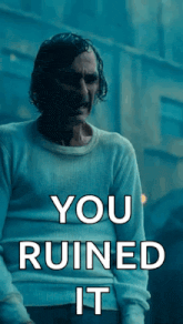a man in a white sweater with the words " you ruined it " on the bottom