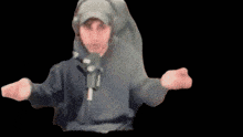 a man wearing headphones and a hat is dancing