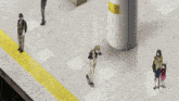 a man standing on a subway platform with a yellow sign pointing to the left