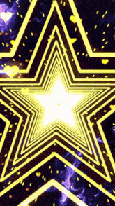 a yellow star with a white center is surrounded by yellow lines on a dark background