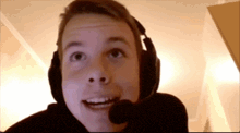 a young man wearing headphones and a microphone