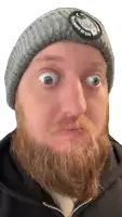 a man with a beard wearing a beanie that says " goes like a feather " on it