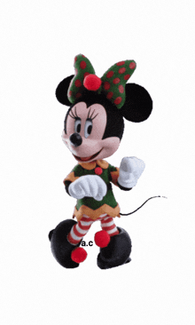 a picture of minnie mouse with the letters a.c. on the bottom right