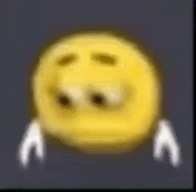 a blurry picture of a yellow smiley face with white arms and eyes .