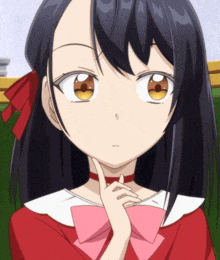 a girl with long black hair and a pink bow on her neck