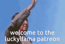 a man is waving in front of a blue sky with the words welcome to the lucky llama patreon