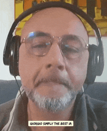 a man wearing headphones and glasses with the words giorgio simply the best ia below his face