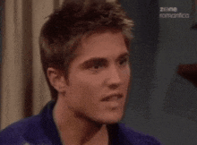 a close up of a man 's face with the words zone romantica on the bottom
