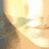 a close up of a person 's face with a blurred background that says ' a ' on it
