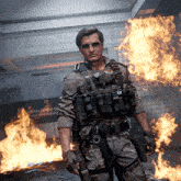a man in a military uniform stands in front of a fire with a sign that says first responders