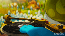 a smurf is playing music on a record player