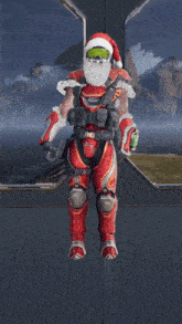 a man with a santa hat and beard is sitting on the ground