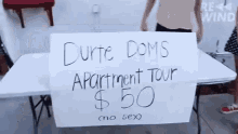 a sign on a table that says " durte doms apartment tour "