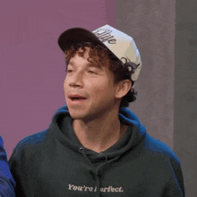 a man wearing a hat that says i 'm cooking