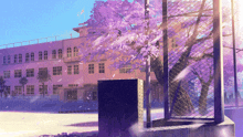 a fence in front of a building with a tree in the foreground