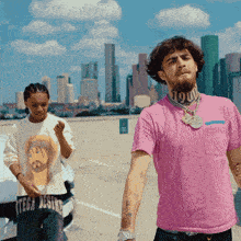 a man in a pink shirt with the number 190 on it