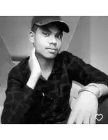 a black and white photo of a young man wearing a hat and plaid shirt