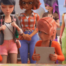 a group of cartoon girls are standing around a table and one of them is reading a piece of paper