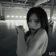a black and white photo of a woman with the word ms on the bottom right