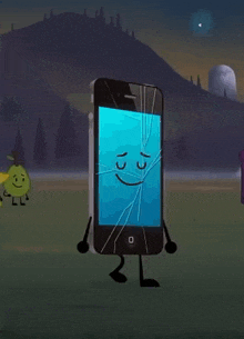 a cell phone with a cracked screen is standing in a field .