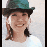 a woman wearing a cowboy hat and smiling