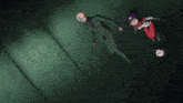 a man in a suit and a girl in a red and white outfit are standing next to each other in a dark room