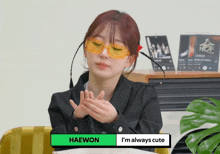 a girl wearing yellow sunglasses says haewon and is always cute