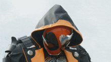 a person wearing a helmet with a hood on it