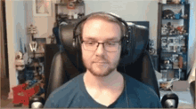 a man wearing headphones is sitting in a chair