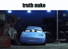 a picture of a blue car with the words " truth nuke " above it