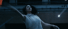 a blurry picture of a woman laying on the ground